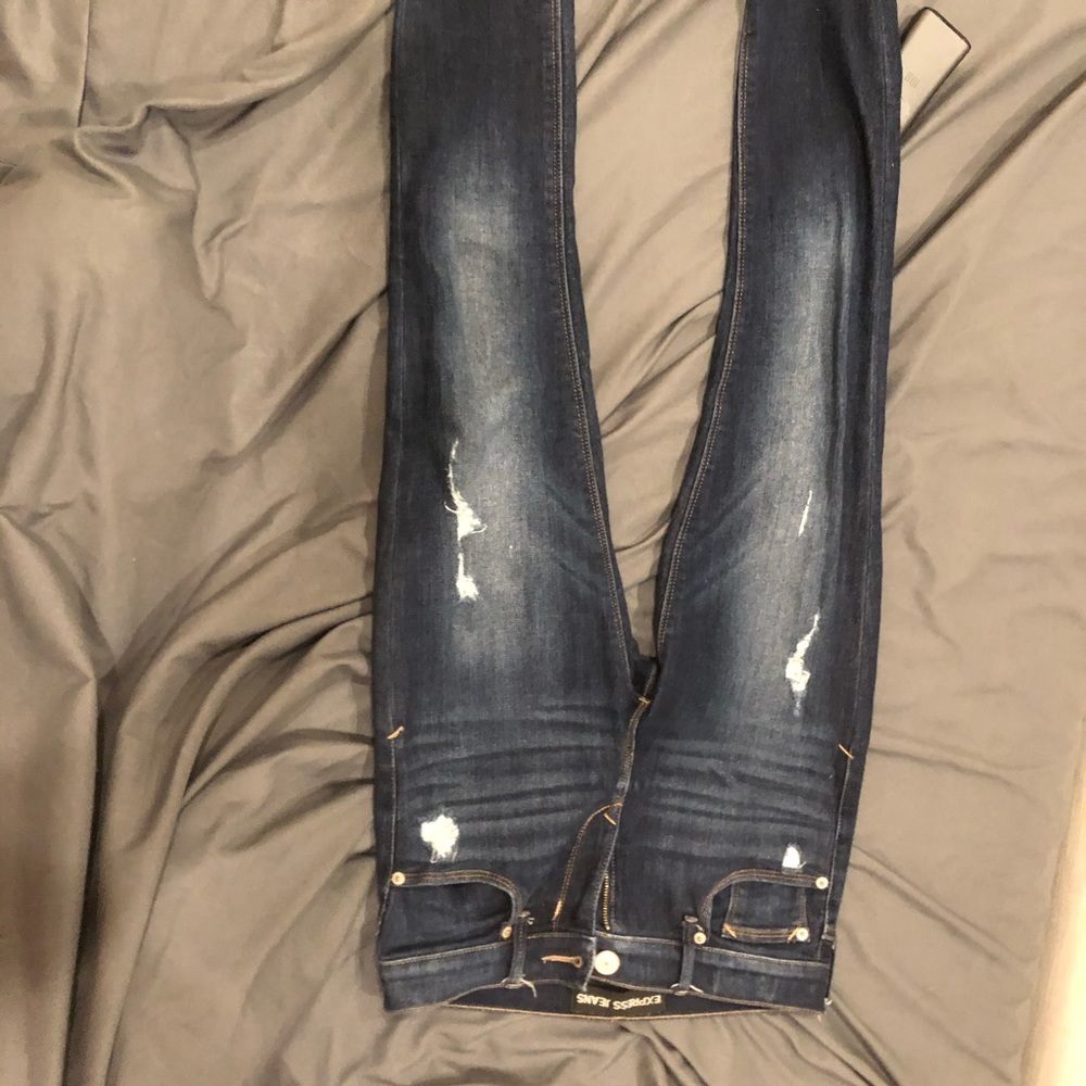 Express dark wash skinny jeans